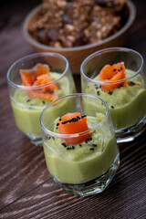 Smoked salmon shot glasses guacamole served with homemade crackers. High quality photo