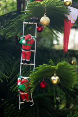 Santa Claus decorating the store interior to welcome the New Year and Christmas