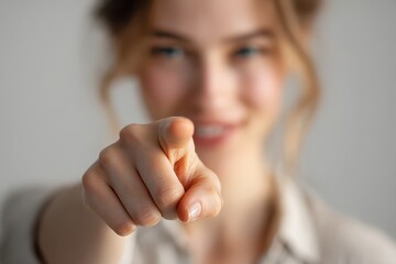 Engaging gesture portrait: friendly individual pointing a finger toward the camera