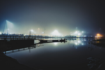 Industrial harbor dock at night in dense fog with water reflection. Turku ,Finland. © Light&Lens