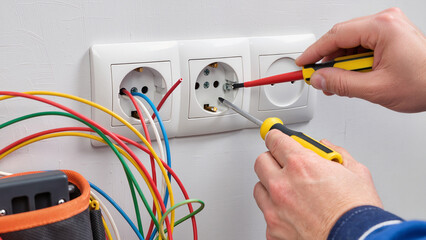 hand with electrical cable