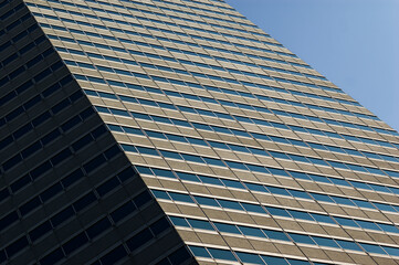 Contemporary Office Building: Clean Lines and Geometric Facade Under Clear Sky