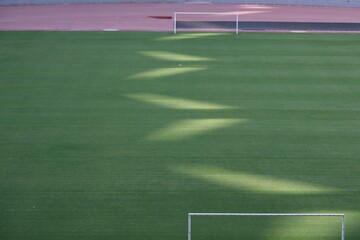 Sunlight patterns on a soccer field