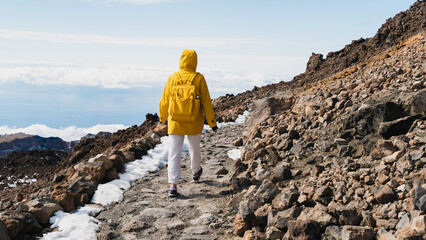 Tourist admiring rock formations in the Teide, Teide National Park, Tenerife, Canary Islands, Spain
