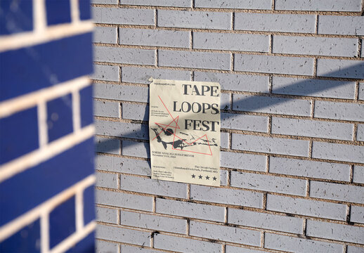 Blank A4 Paper Poster on a Brick Wall. PSD template mockup.