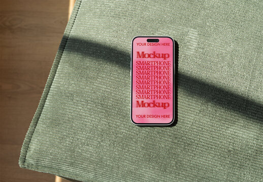 Mockup of Smartphone on Green Fabric