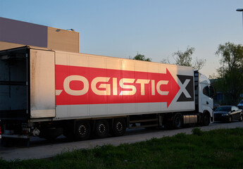 Truck Parked on a City Street at Sunset. PSD template mockup.
