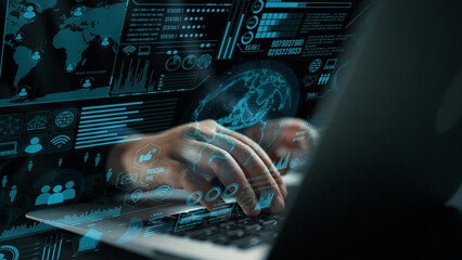 This image illustrates hands typing on a laptop amidst dynamic data visualizations, emphasizing the...