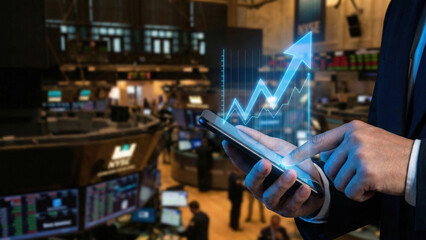 Stock trading high level planning digital chart growth concept in busy exchange hall background with confident investor hand on smartphone screen