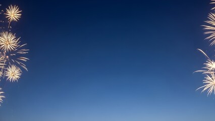 Vibrant fireworks exploding in dark blue night sky with sparkling lights