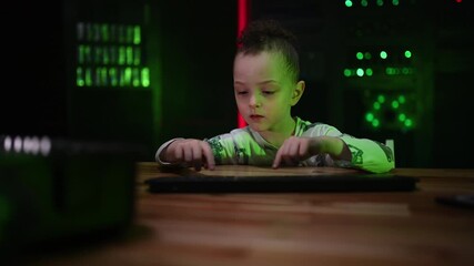 Little boy prodigy typing on a keyboard in a server room - Powered by Adobe