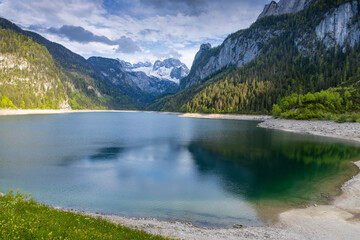 Gosausee lake in Austria Alps mountains. Austria alpine landscape in summer near Dachstein mountain range. Scenic waterfront and natural surroundings popular tourist destination in Austria Gosau See