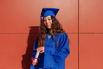 Young woman smiling, celebrating academic achievement and a bright future