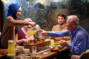Family gathers for iftar meal during Ramadan celebration with joyful moments and shared food...