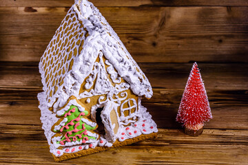 Gingerbread house on a wooden background. Christmas and New year concept