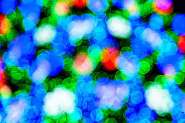 Background of the blurred colorful christmas lights. Bokeh pattern