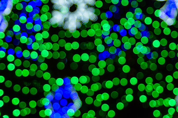 Background of the blurred colorful christmas lights. Bokeh pattern