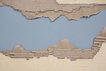 Torn Corrugated Cardboard Texture Background, Ripped Brown Kraft Paper with Peeling Layers.