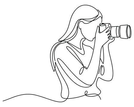 Woman Photographer Capturing Moment with Camera