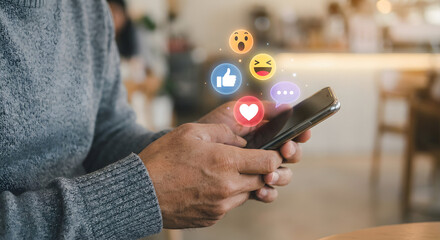 man using smartphone with social media icons