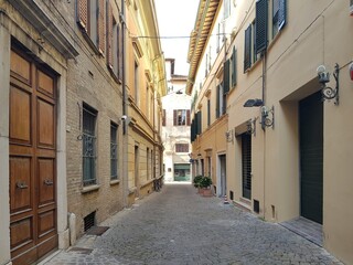Narrow street in the old town of Bologna, Italy