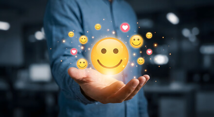 Man holding smiley face emoticon with various emojis