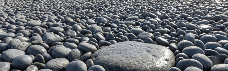 Fototapeta premium Smooth Wet Grey Pebbles and Stones Texture
