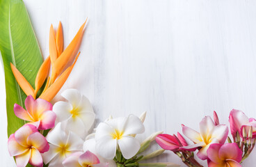 white wood texture with Heliconia and plumeria flower