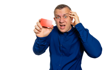 Stressed man holding credit card and touching head, on transparent background.