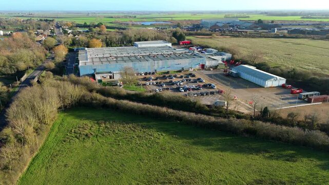 Aerial view of industrial distribution centre, Smith packaging warehouse and factory, transport and logistics hub in Ely, United Kingdom.