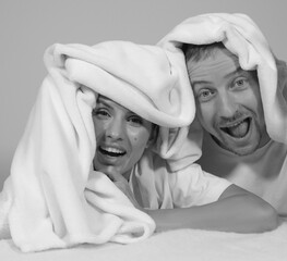 Beautiful romantic couple foreplay in bed. Couple in love. Sensual. Funny photo. People. Man and woman. 
