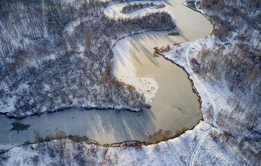 Aerial photo of Koen river under ice and snow. Beautiful winter landscape.