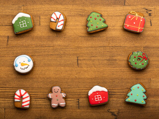 Festive iced gingerbread cookie assortment on wooden table