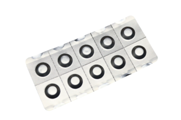 A pack of pills placed on a clean white table, ideal for medical or pharmaceutical settings