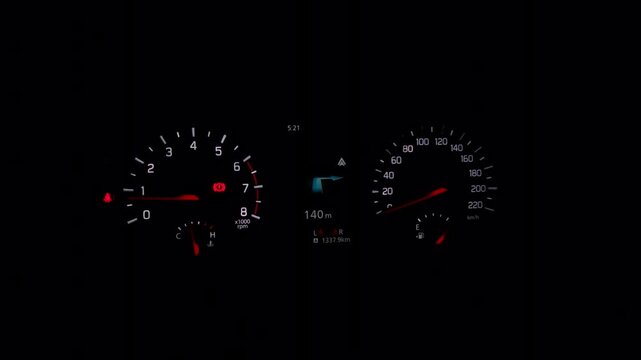 Nighttime driving scene features a glowing car dashboard with analog gauges and a digital screen, representing automotive technology and road travel.
