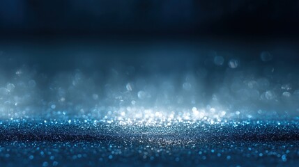 Abstract glittering lights with bokeh effect on blue and dark colors backdrop, creating elegant modern vibe for creative designs events or festive occasions.