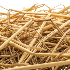 Close up of dry golden straw stalks against a black background yellow