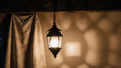 Illuminated lantern casting a warm glow in the darkness.