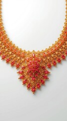 Intricate golden necklace with red stones