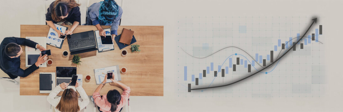 A diverse business team collaborates on financial strategy, analyzing data and discussing ideas in a modern workspace. The growth graph indicates success. Impute - Powered by Adobe
