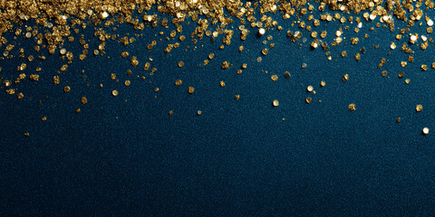 Abstract background with gold glitter on a blue background. Scattered glitter particles on a dark blue background. Festive banner with clear space.