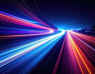 Long exposure of highway traffic with streaks of vibrant color against a dark blue sky