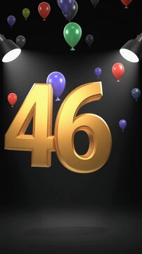 Number 46 in the spotlights with balloons in the background. Festive scene for birthday or anniversary party