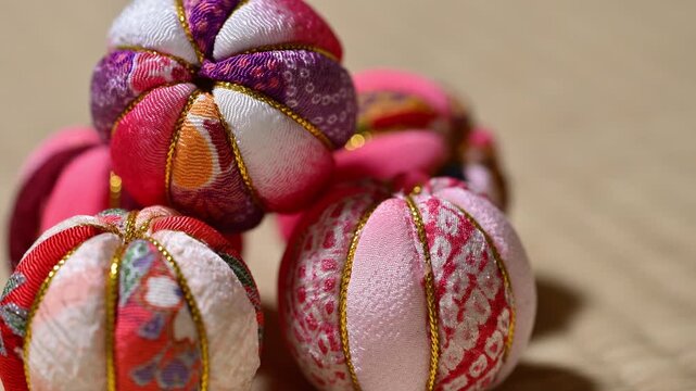 Close-Up of Multiple Traditional Japanese Temari Balls on Tatami Mat
