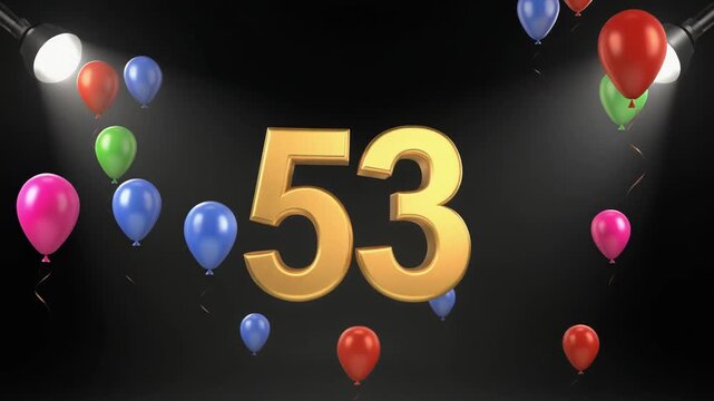 Number 53 in the spotlights with balloons in the background. Festive scene for birthday or anniversary party