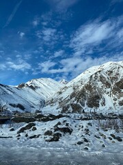 Snowy mountain landscape under clear blue sky, perfect for winter background scenes and projects