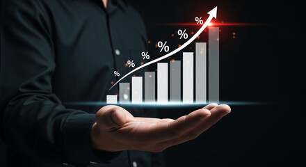A hand holds a rising bar chart displaying percentage growth and financial success.