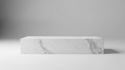 A white marble pedestal with a smooth, polished surface.