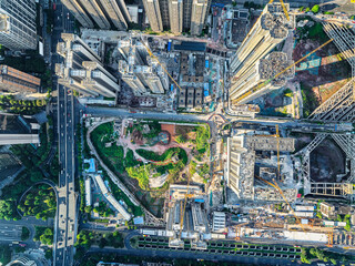 Aerial view of the construction site with cranes and buildings in the city.