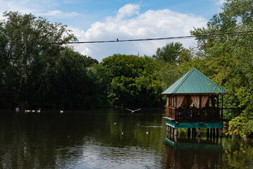 View of a turquoise bay, trees and residential houses in the